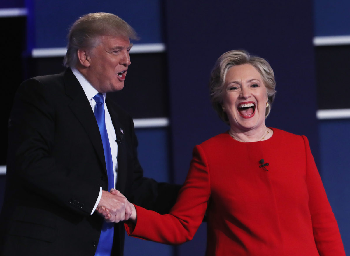 HEMPSTEAD, NY - SEPTEMBER 26:  (L-R) Republican presidential nominee Donald Trump and Democratic presidential nominee Hillary Clinton shake hands after the Presidential Debate at Hofstra University on September 26, 2016 in Hempstead, New York.  The first of four debates for the 2016 Election, three Presidential and one Vice Presidential, is moderated by NBC's Lester Holt.  (Photo by Spencer Platt/Getty Images)